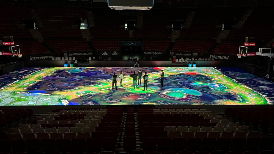 Venue glass-floor activation concept · TFT × League of Legends